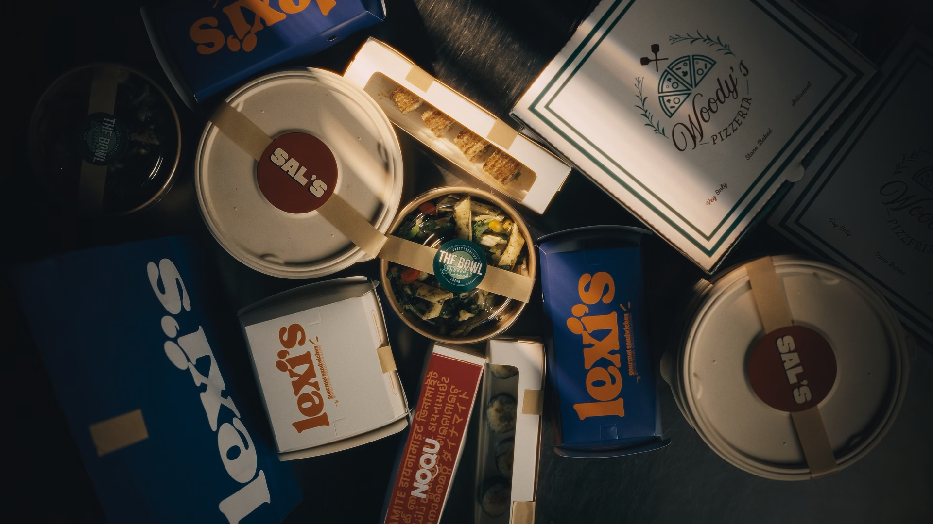 Food Lab brands including Lexi's, Woody's Pizzeria, Sal's, The Bowl and Noon